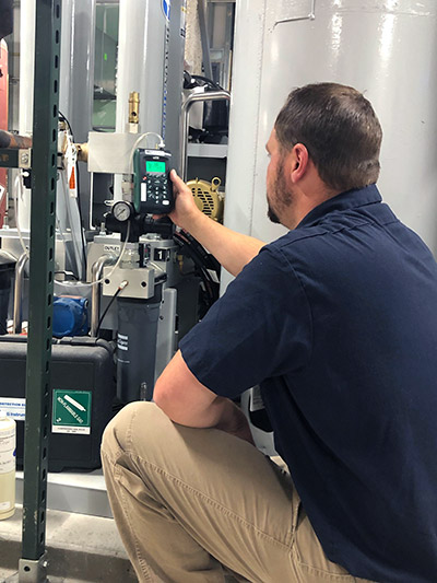 Man Inspecting Equipment